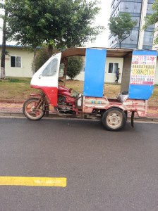 A handicapped Chinese taxi ... No, no I'm not kidding :-) I wonder where the wheelchair goes? Perhaps the roof?