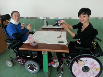 Nu Jia proudly showing her winning necklace